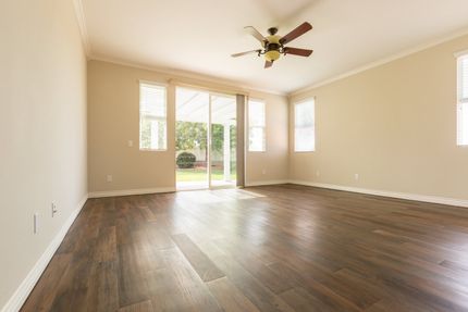 white room with wood flooring
